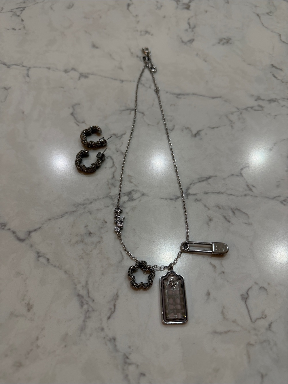 Coach Silver-tone Pendant Necklace with Charm Accents and pave studded earrings